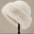 Thick warm white faux fur winter bucket hat displayed on a professional wooden stand - Milky White