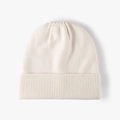 Cream knit beanie with wide ribbed cuff and soft textured yarn for winter warmth - One Size / Off White