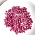 Close-up of bright pink acrylic cylindrical beads with holes for DIY jewelry making - 16# Plum Red