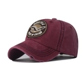Close-up of distressed brim and embroidered eagle patch on a vintage red baseball cap - M (56-58cm) / Wine Red