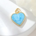 Macro view of light blue heart pendant with 14K gold plated frame and glitter texture - Light Blue