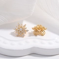 Elegant gold snowflake stud earrings with sparkling pavé crystals in a symmetrical floral design - 1 Piece / Gold
