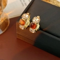 Detail of vintage gold hoop earrings with amber and clear square cut crystals on box - Vintage Square Rhinestone Style / Ear Clip Gold Brown