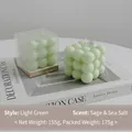 Light green cube bubble candle scented with sage and sea salt on a designer book - Light Green (Sage & Sea Salt) Shrink Wrapped
