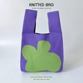 Detailed close-up showing the fine knitted texture and floral pattern of the purple tote bag - Green Purple Four Petal Flower