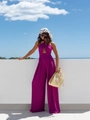 Detail of fuchsia halter jumpsuit featuring high waist cut and flowing wide leg trousers - S / Purple