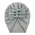 Detail of grey baby cotton beanie featuring three soft decorative bows on knit fabric - Gray