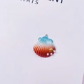 Detailed view of ocean shell pendant with blue to red gradient and pearl accents - Small Shell / Blue-Orange Gradient (With Gold Starfish)