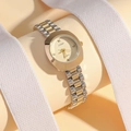 Detail view of JUSMI two-tone gold quartz watch on elegant ribbon display background - Gold Dial