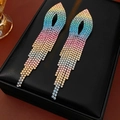 Close-up of rainbow gradient rhinestone tassel earrings on a black leather jewelry box - Silver Needle Gold-Plated Gradient Rainbow