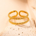Minimalist double-layer golden titanium ring with beaded texture on a textured stone - Gold 115