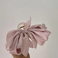 Close-up of pink satin bow hair claw clip showing silk fabric and acrylic base detail - Large Bowknot / Light Pink Purple