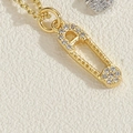 Macro view of gold-plated paperclip necklace with small zircon pendant detail - Paperclip Design-14K Gold (XL2573-5)