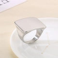 Close-up of polished silver stainless steel square signet ring on a wooden background - US 6 / Polished Silver