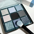 Detailed top view of nine-color eyeshadow palette with cool blue and silver tones - No. 08 Cool Blue Grey Tones