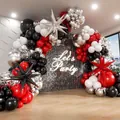 Detail of luxury black gold party balloons with silver star foil and Let's Party neon sign - Black Red Silver