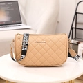 Beige quilted shoulder bag with embroidered strap and metal logo accent - Apricot
