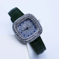 Detail of a square silver watch case with small diamonds and green leather strap - Green Silver Case