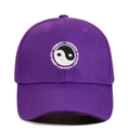 Close-up of Yin Yang embroidery and Swimming text on purple cotton baseball cap - Adjustable / Purple