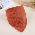 Detailed view of orange double-layer muslin cotton baby bib with soft wrinkled texture - Orange Red