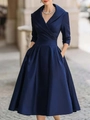Detailed view of dark blue satin dress fabric texture and elegant V-neck pleated design - S / Dresses / Dark Blue