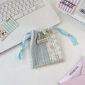 Detail of floral lace drawstring bag with retro pastoral pattern and Sozakka label - Hollow Patchwork Blue Grid
