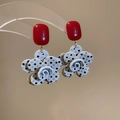 Detail view of resin floral drop earrings with red square top and polka dot petals - Red Polka Dot Floral Style (925 Sterling Silver Earring Post)