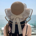 Coffee brown straw sun hat for women featuring beige lace bow and ruffled yarn edge - Net Ribbon Khaki
