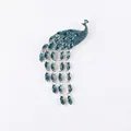 Elegant silver-tone peacock brooch featuring blue crystals and delicate tassel chains - Silver Blue Crystal Peacock Tassel (XD822007-1)