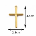Golden stainless steel cross pendant with smooth finish measuring 3.4cm by 2.1cm - Size 7 / Gold