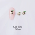 Macro detail of 8x8mm gold peach nail charms with green leaves on a white background - Bright Gold Peach (Gold Base) (8343)