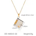 Dettaglio del ciondolo a libro in oro 18K con cuore intagliato e dimensioni prodotto - Libro Bicolore Oro e Argento