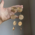 Elegant gold drop earrings with four tiered textured circular discs in a retro style - Gold Round Serial