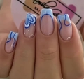 Close-up of square nails with deep blue heart patterns and abstract wavy textures - Blue Heart Wave (CW582)