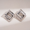 Detail of silver geometric interlocking square earrings with polished metallic finish - Silver (Silver Pin) / Silver
