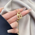 Close-up of gold snake pendant with cubic zirconia on purple silk background - 0623-Gold Pave Snake