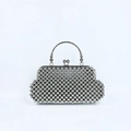 Close-up of the silver beaded texture and vintage metal clasp of the evening clutch bag - Silver