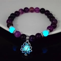 Detailed view of purple beads yoga bracelet with glowing blue beads and lotus charm - 8mm Natural Purple Agate with Blue Light