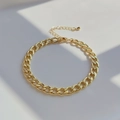 Close-up of golden Cuban chain bracelet with lobster clasp and adjustable extension link - Gold Cuban Chain Style (JSS220040A)