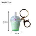 Detail view of a sundae keychain with size dimensions showing 5.8cm height and 33.4g weight - Sundae Green