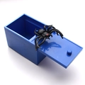 Blue sliding spider prank box with realistic black spider popping out for Halloween fun - Blue