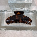 Elegant amber tortoiseshell acetate shark hair claw clip on glass display stand - Dark Tortoiseshell