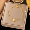 Double-layer stainless steel gold heart bracelet on a beige leather jewelry box - Heart Double-Layered Bead Chain - Gold