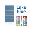 Close-up of Turkish beach towel in lake blue with tassels and multi-color fabric swatches - Lake Blue