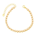Close-up of gold tennis bracelet with pink zircons and heart pendant detail - Pink