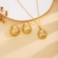 Golden jewelry set with spiral teardrop pendant necklace and matching drop earrings - Gold Spiral Teardrop Style