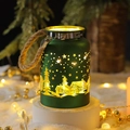 Dark green metal lantern with pine tree cutout pattern and glowing warm LED light - Flowing Light Bottle / Green