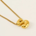 Polished golden balloon letter S pendant on a classic Cuban chain for women - Letter S