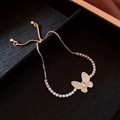 Elegant gold zircon flower bracelet with adjustable chain on black jewelry tray - Gold Butterfly Bracelet