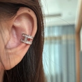 Close-up of silver-tone H-shaped ear cuff with sparkling pavé cubic zirconia inlay - Silver (Single)